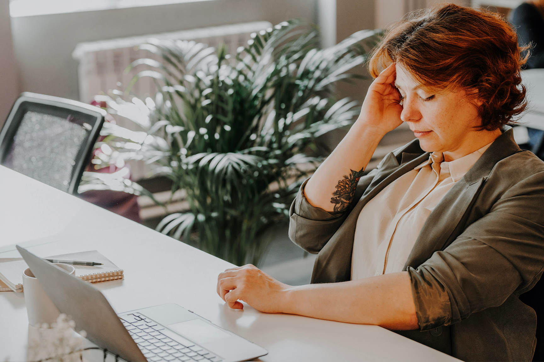 woman at office needing migraine treatments